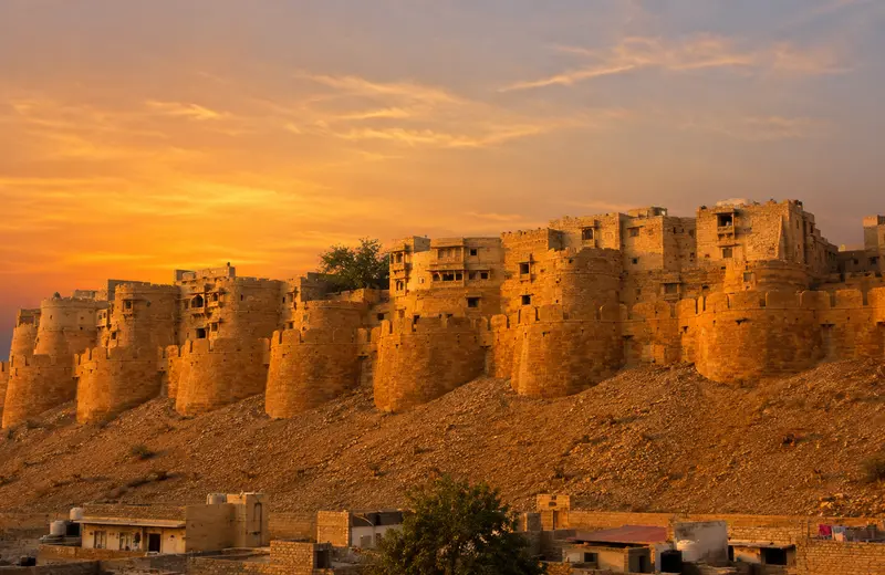 Golden sandstone walls of Jaisalmer Fort glowing at sunset, Rajasthan