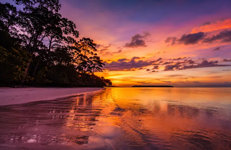 Sunset view at Radhanagar Beach Havelock Island with golden sky reflecting on the sea