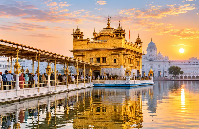 Golden Temple reflecting in the Amrit Sarovar at sunrise in Amritsar, Punjab