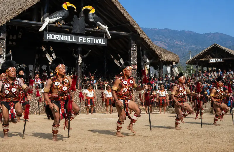 Naga tribal dancers in traditional dress performing at the Hornbill Festival, Kisama