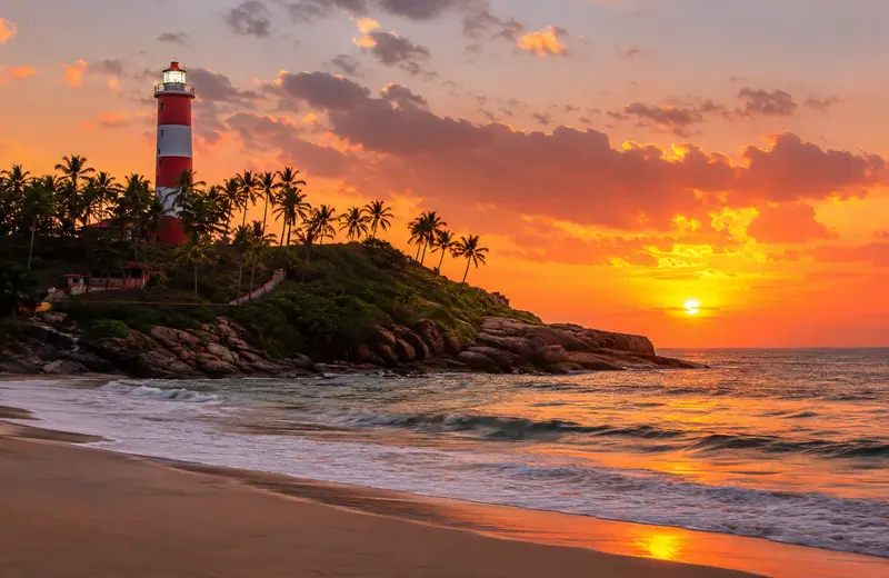 Vizhinjam Lighthouse at sunset over Lighthouse Beach, Kovalam