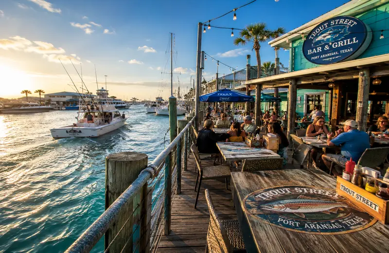 Waterfront seafood restaurant overlooking the marina in Port Aransas, Texas.
