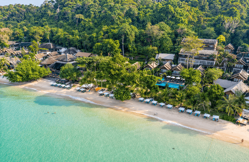 Aerial view of Ao Prao Beach, Koh Samet, Thailand with clear blue water and sandy beach.