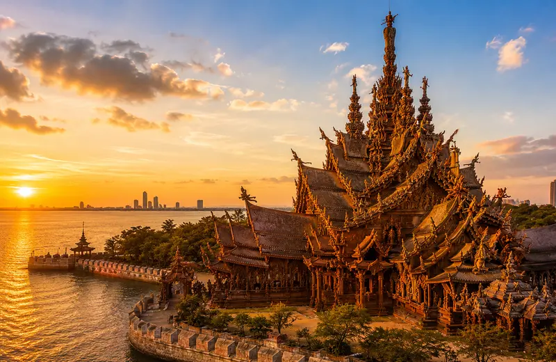 Sanctuary of Truth wooden spires glowing at golden hour, the best photo time in Pattaya