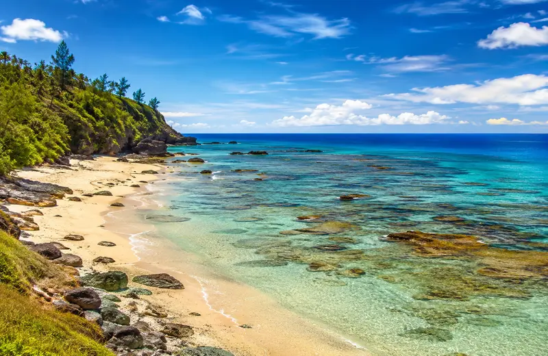 Fiji Coral Coast with turquoise water, coral reefs, and a tropical beach.